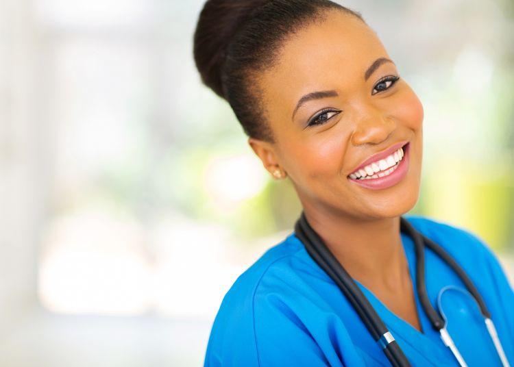 happy african nurse looking at the camera