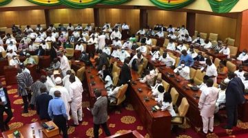 Ghana’s Parliament Erupts into Chaos as NDC MP whisks away Speaker’s seat